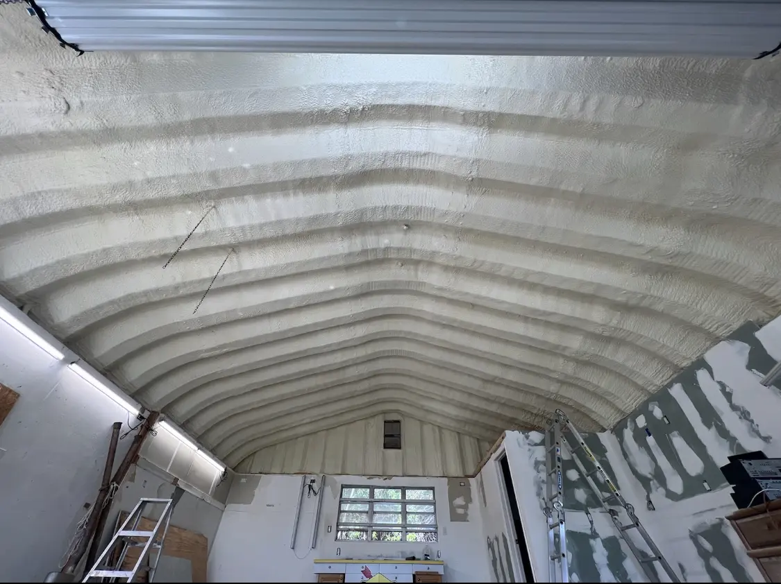 Spray polyurethane foam applied to the underside of a metal roof deck in Christiansburg
